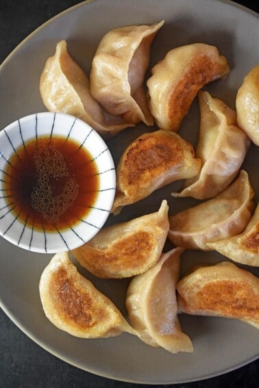 An overhead shot of Paleo Potstickers and a dipping sauce