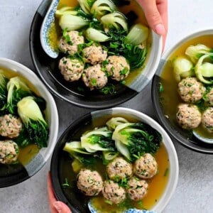 An overhead shot of four bowls of paleo, Whole30, gluten-free, keto, and low carb wonton soup.