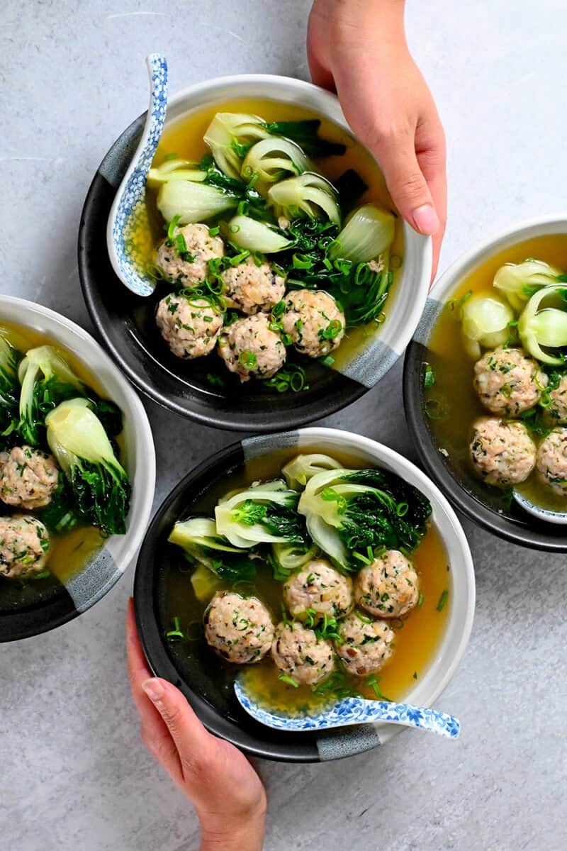 An overhead shot of four bowls of paleo, Whole30, gluten-free, keto, and low carb wonton soup.