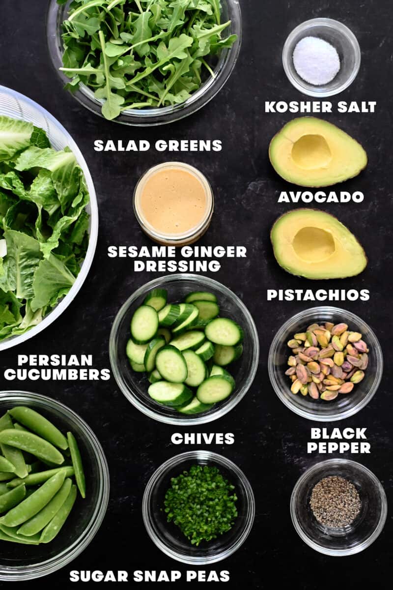 An overhead shot of the raw ingredients for chopped salad with sesame ginger dressing.