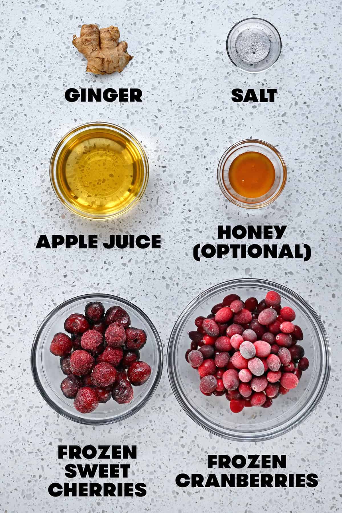 An overhead shot of the raw ingredients to make paleo cranberry sauce with cherries.