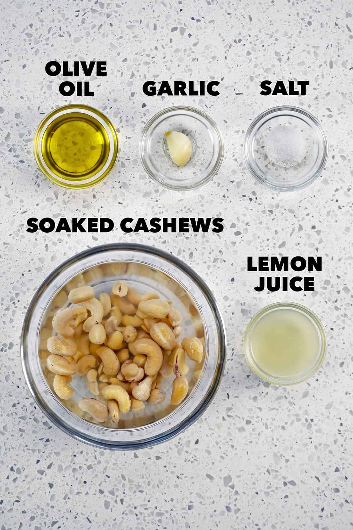 An overhead shot of the raw ingredients to make a dairy free cashew cream.