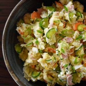 An overhead shot of a serving bowl filled with Japanese potato salad.