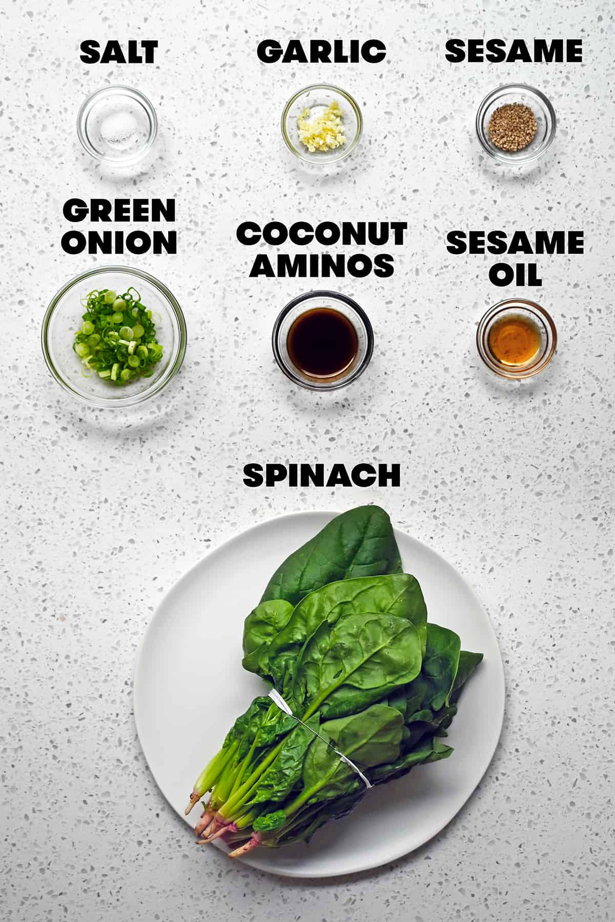 An overhead shot of the raw ingredients to make Korean spinach side dish, sigeumchi namul.