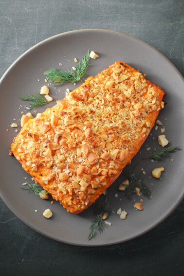 An overhead shot of a plate of macadamia-crusted sriracha ranch salmon.
