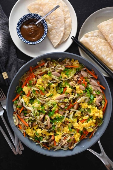 An overhead shot of a big plate of Moo Shu Chicken, with gluten free and Whole30 hoisin sauce and wrappers.