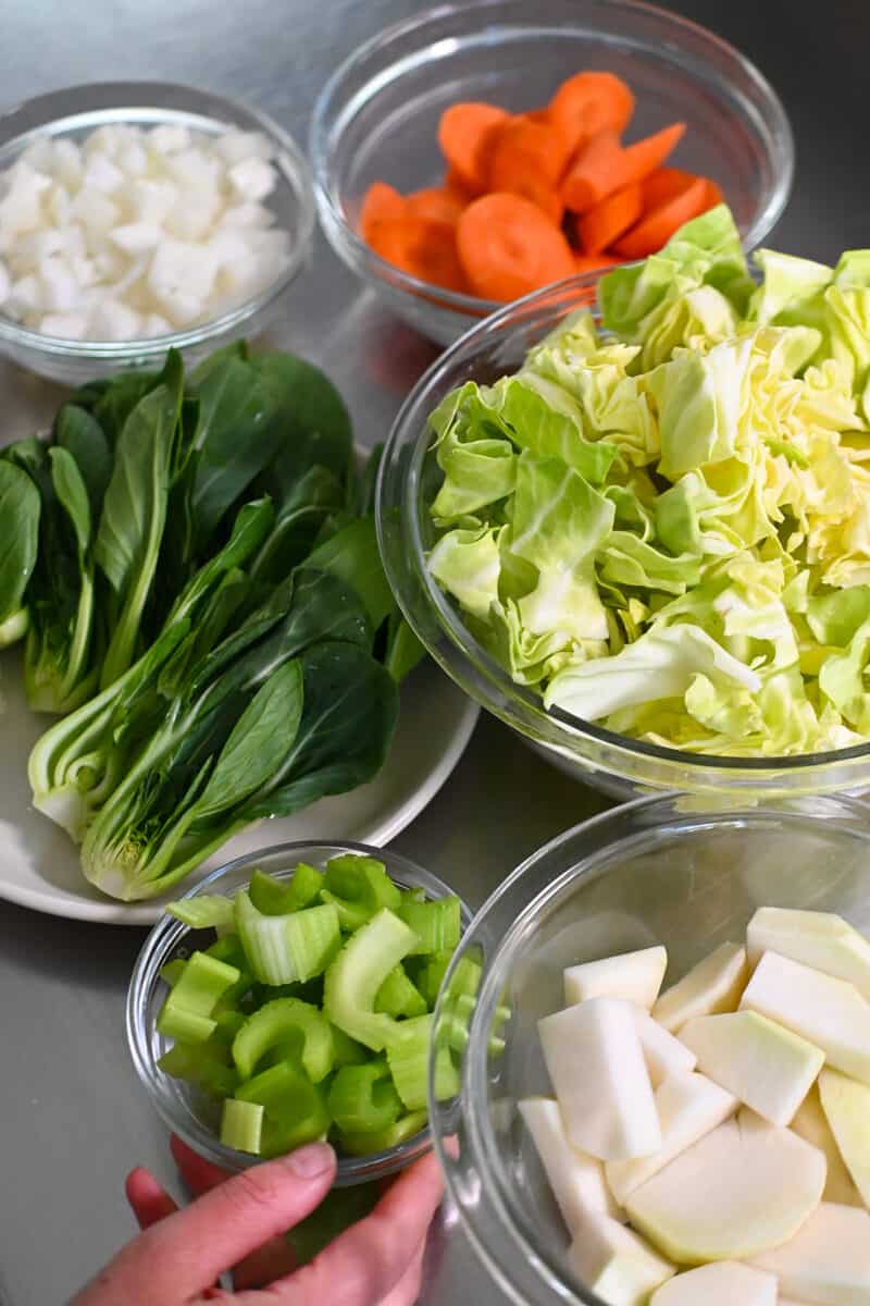 An overhead shot of the chopped vegetables for oxtail soup