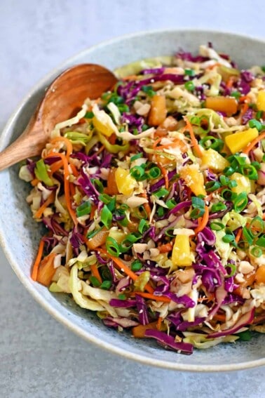 An overhead shot of a large bowl filled with pineapple coleslaw.