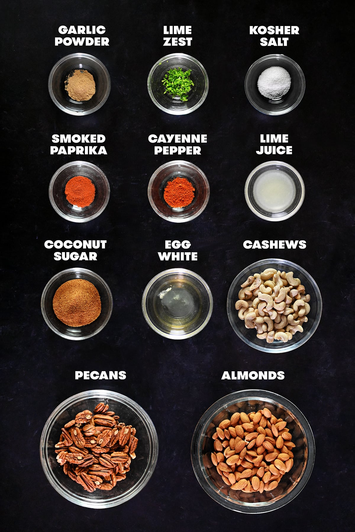 The measured out and labelled raw ingredients to make paleo spiced nuts.