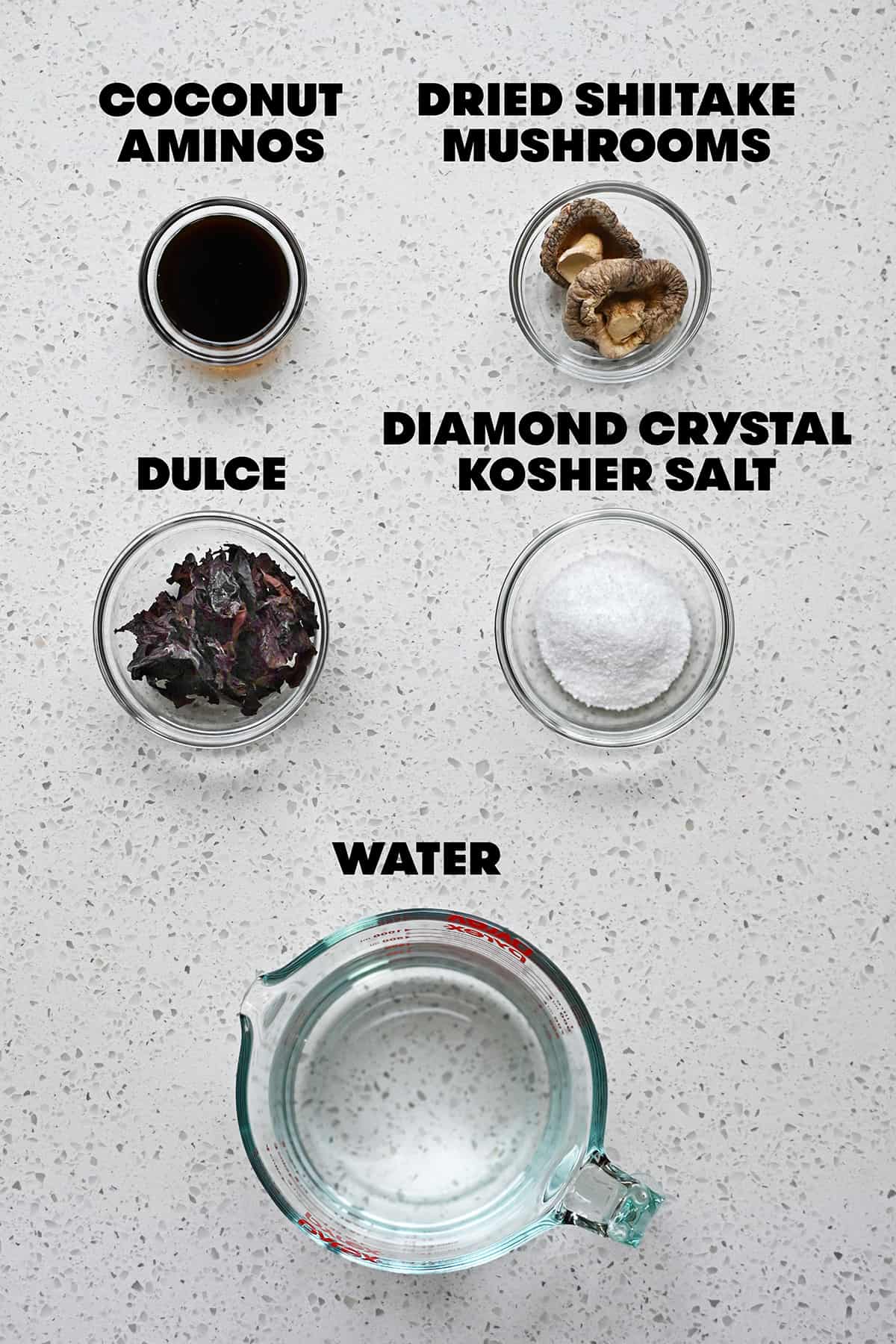 An overhead shot of the five raw ingredients needed to make a homemade vegan fish sauce.