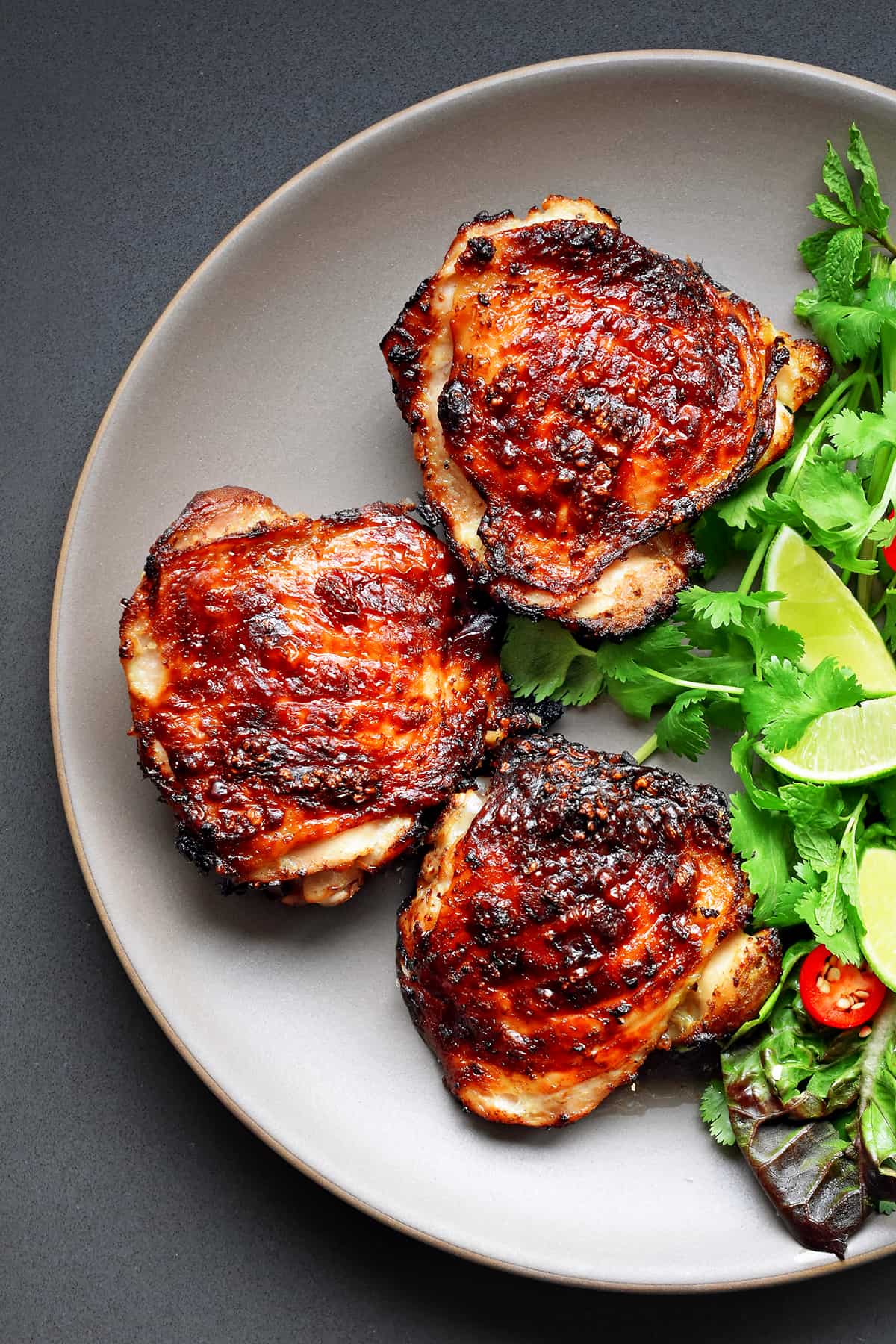 A closeup overhead shot of Vietnamese Lemongrass Chicken on a plate.