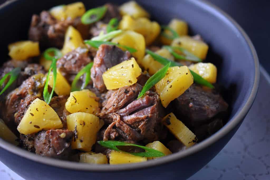 A closeup shot of a bowl of Instant Pot Spicy Pineapple Pork