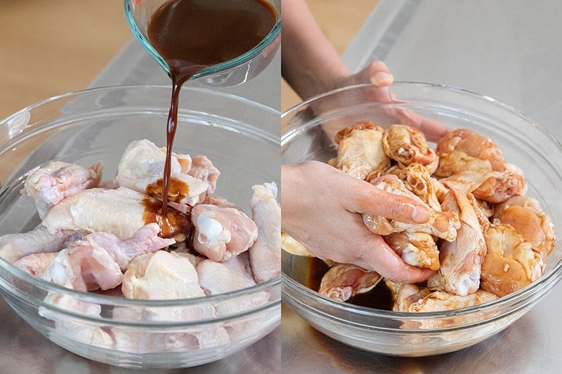 Pouring whole30 marinade on Chinese Chicken Wings and tossing them with clean hands.