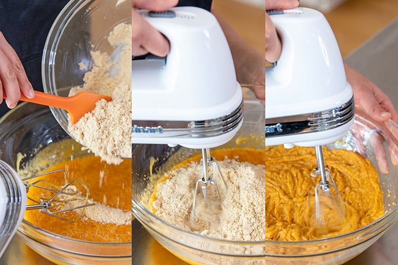 Adding the dry ingredients to the wet ingredients and then using a hand mixer to blend the paleo pumpkin muffin batter.