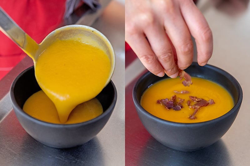 A black bowl is being filled with Instant Pot butternut squash soup. On the right the bowl of Whole30 soup is being topped with bacon bits and balsamic vinegar.