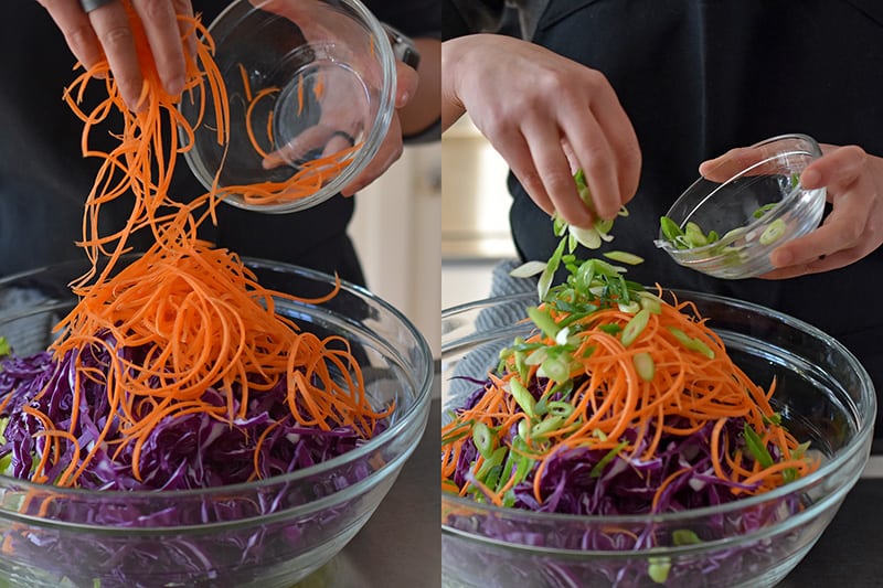 Combining the vegetables in a large bowl to make Whole30 Chinese Chicken Salad.