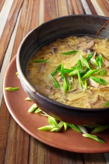 A closeup of paleo hot and sour soup in a bowl ready to be served.