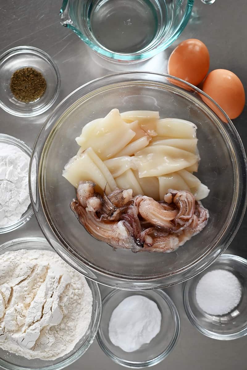 An overhead shot of the raw ingredients to make paleo fried calamari in the air fryer or on the stove.