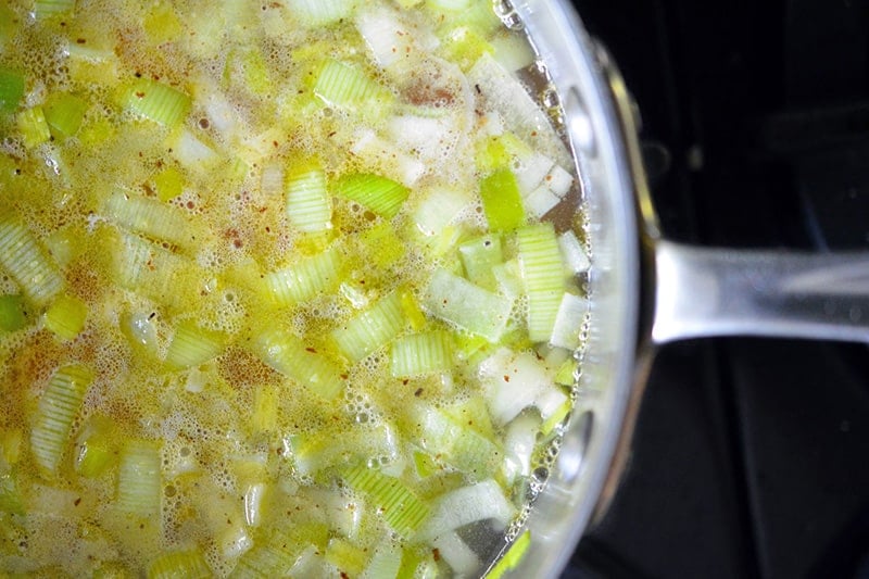 Simmering Carrot Cardamom Soup in a saucepan