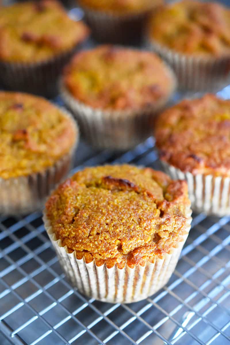 A closeup of the paleo pumpkin muffins on a wire rack.