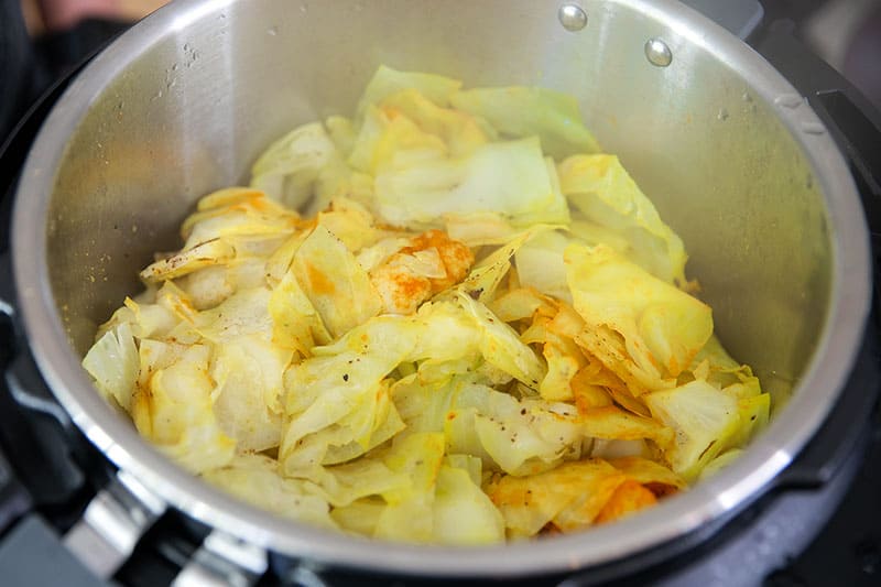 An overhead shot of an open Instant Pot filled with low carb Ethiopian cabbage stew.