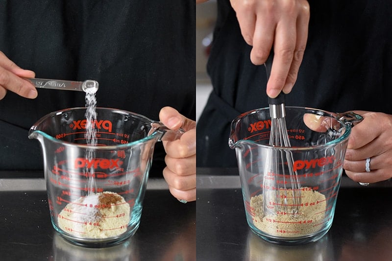 Adding the dry ingredients for pumpkin mug cake to a liquid measuring cup and whisking it together.