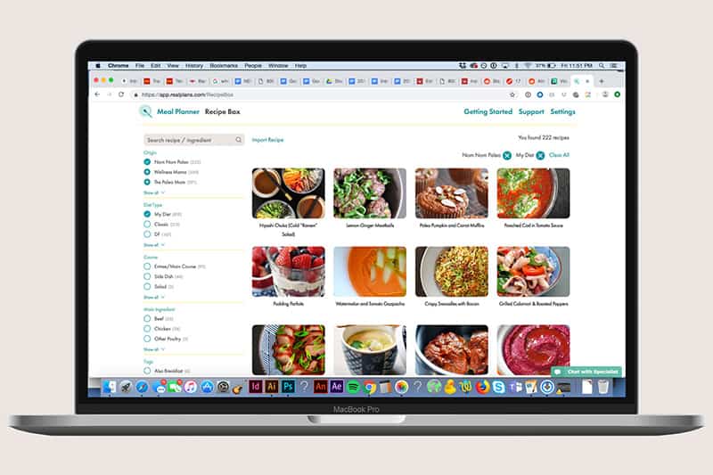 A laptop is showing the Real Plans Nom Nom Paleo meal planning program.