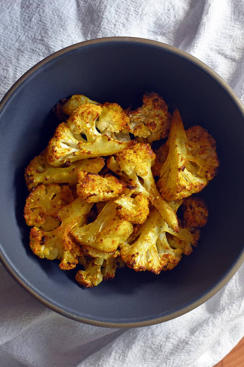 An overhead shot of a bowl of Roasted Curried Cauliflower