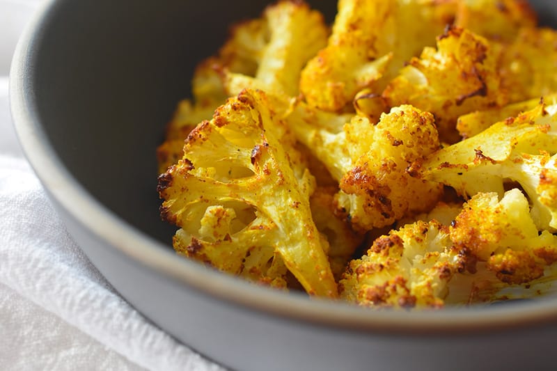A closeup bowl of Roasted Curried Cauliflower.