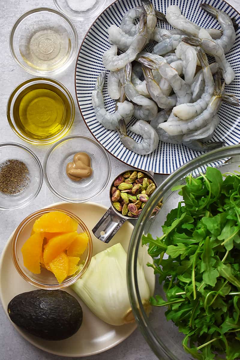 An overhead shot of the raw ingredients for shrimp and avocado salad