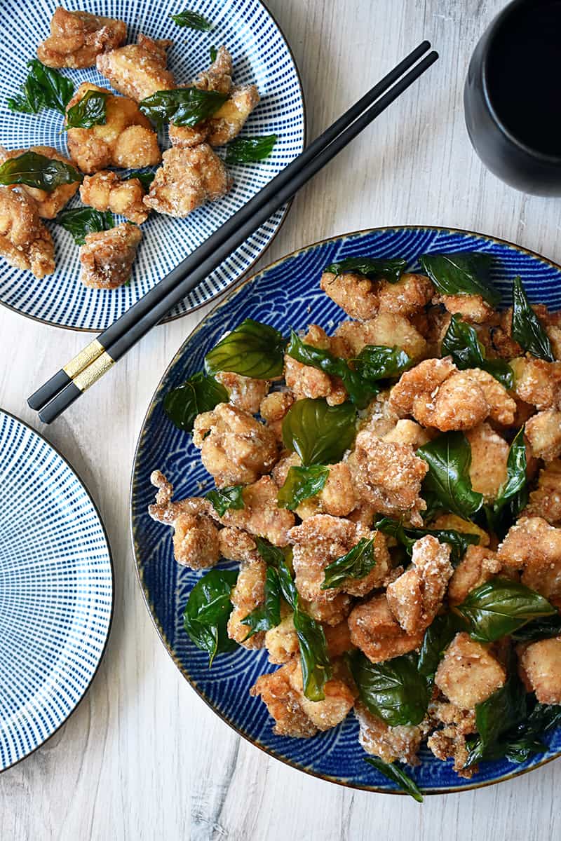 An overhead shot of Taiwanese fried chicken with fried basil.