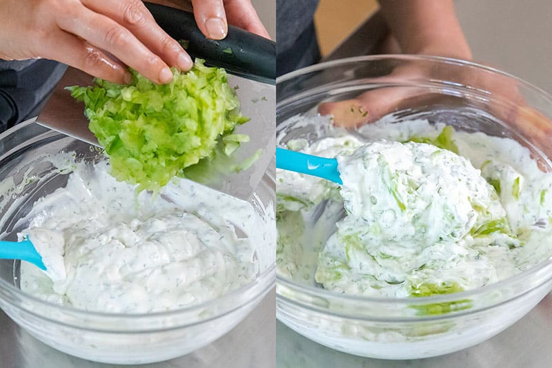 Adding the drained and diced cucumbers to the vegan tzatziki base.