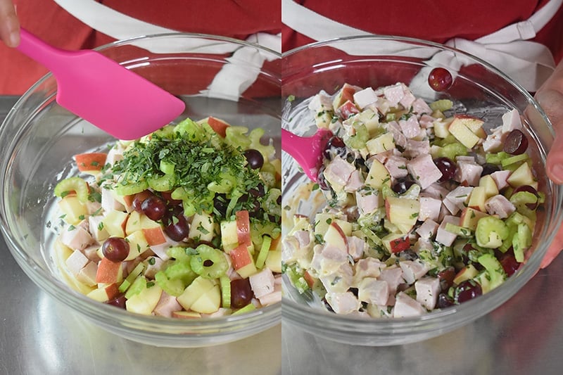Mixing in the fresh herbs into a chicken waldorf salad.