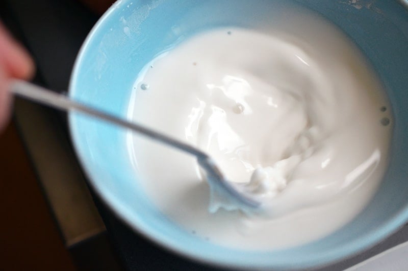 A blue bowl is filled with an arrowroot slurry