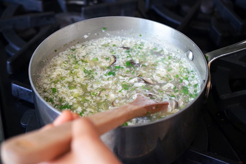 A side view of West Lake Beef Soup in a saucepan that is ready to be ladled into bowls.