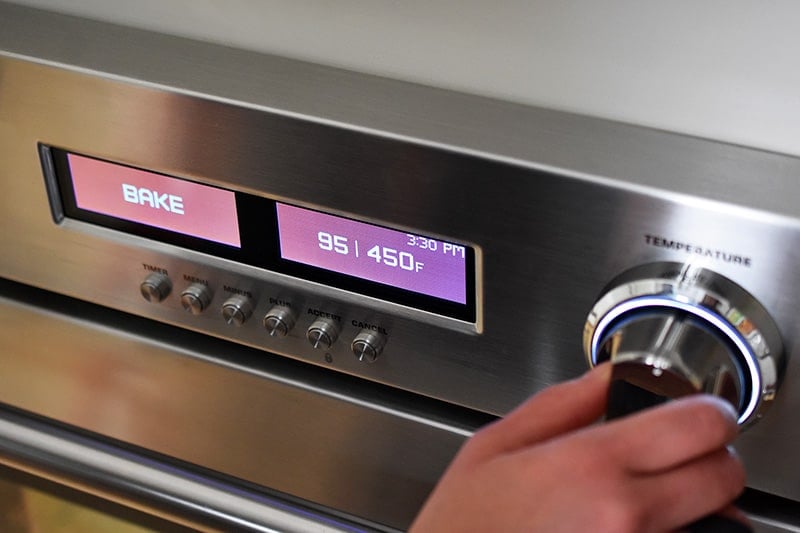 Preheating the oven to 450 F.