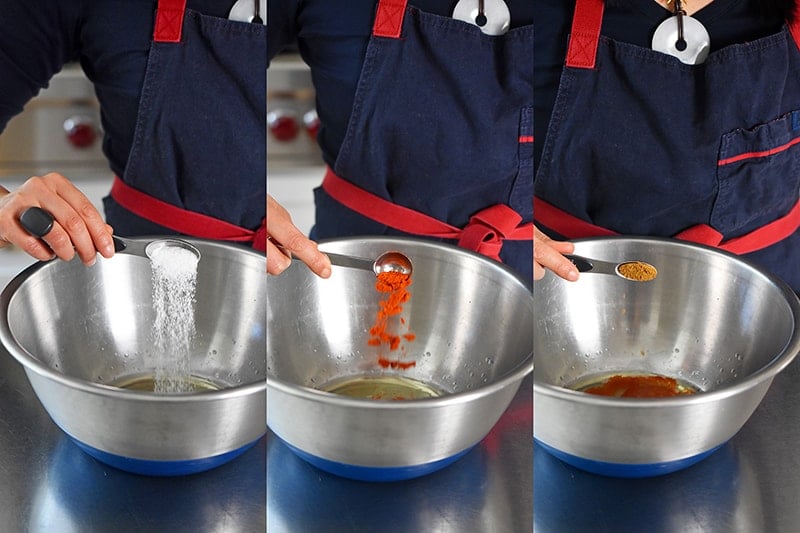 Adding the seasoning to the Sheet Pan Chicken Fajitas marinade