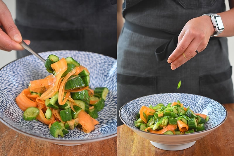 Transferring the paleo and whole30 smashed cucumber and carrot salad into a bowl and topping with sesame seeds.