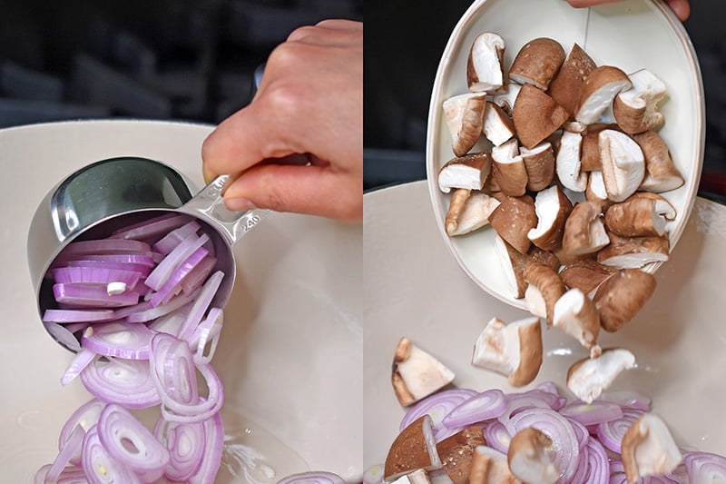 Adding sliced shallots and quartered shiitake mushrooms to a pot to make Whole30 and keto Tom Kha Gai