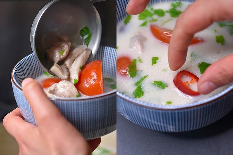 Ladling a bowl of homemade gluten-free Tom Kha Gai and adding sliced red chili peppers