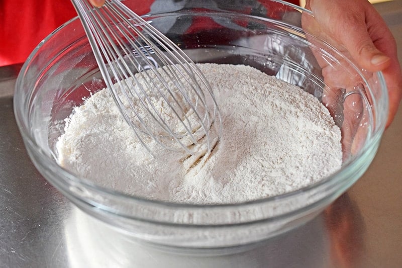 Whisking the flours for the Paleo Curried Meat Pies 