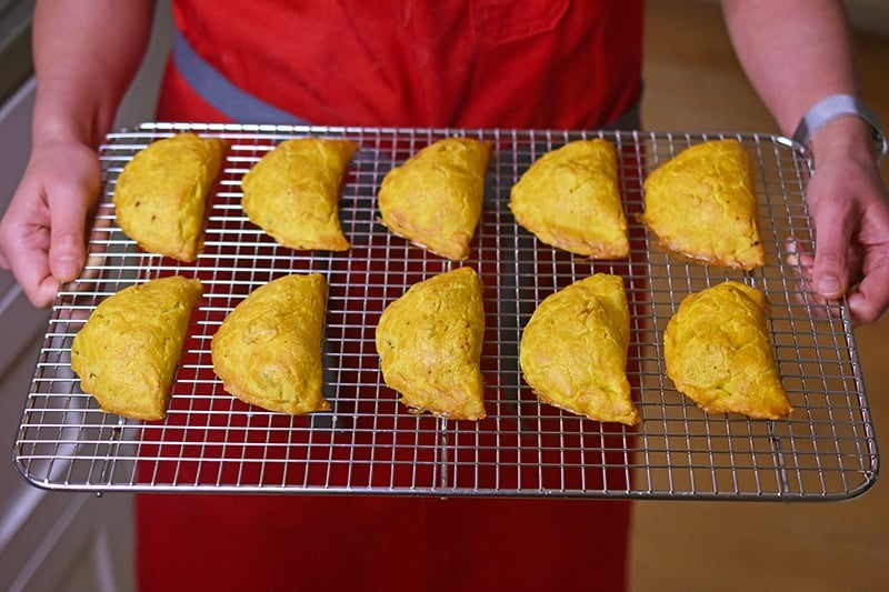 Paleo Curried Meat Pies on a cooling rack.