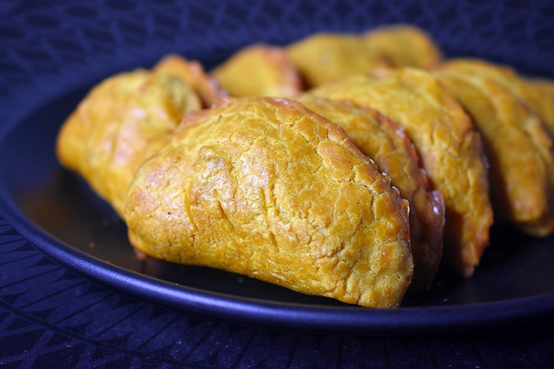 A side view of a plate filled with Paleo Curried Meat Pies 