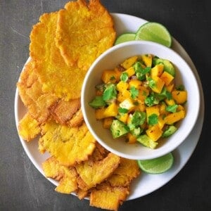 An overhead shot of Fried Green Plantains + Mango Avocado Salsa.