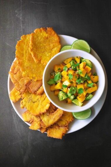An overhead shot of Fried Green Plantains + Mango Avocado Salsa.