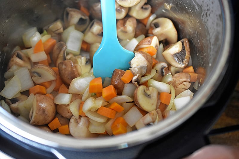 Sauteing the vegetables in an open Instant Pot to make Whole30 Summer Italian Chicken 
