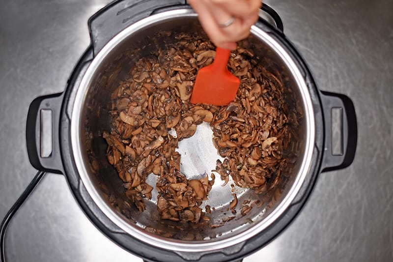 An overhead shot of sautéed mushrooms in an Instant Pot.