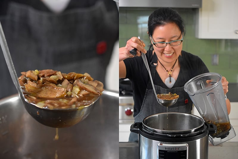 Someone ladling out the cooked mushrooms out of the Instant Pot and into a high speed blender.