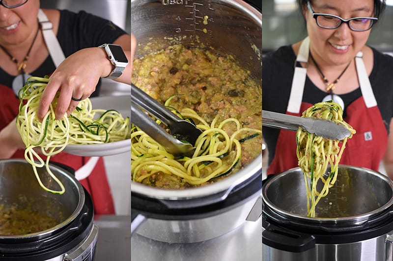 Raw zucchini noodles are added to Instant Pot Zucchini Bolognese to heat up.