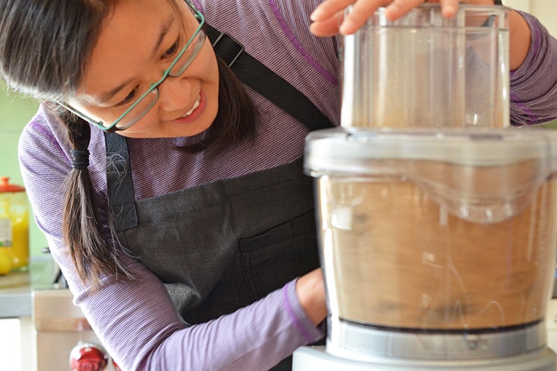 Pulsing the dried porcini mushrooms in a food processor into a powder to make Magic Mushroom Powder 